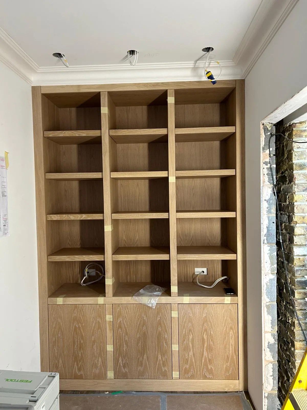 Oak alcove bookcases with cupboards below: Shelves and doors fitted