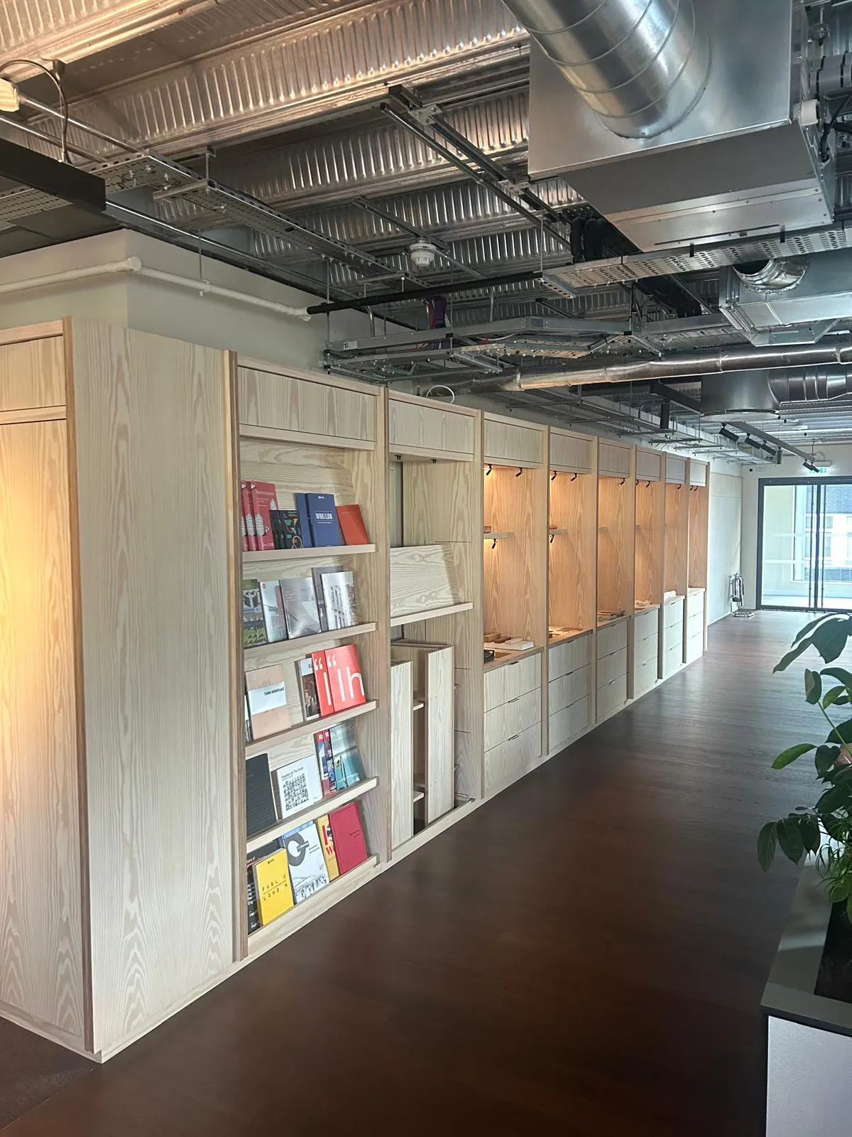 Veneer shelving along the wall